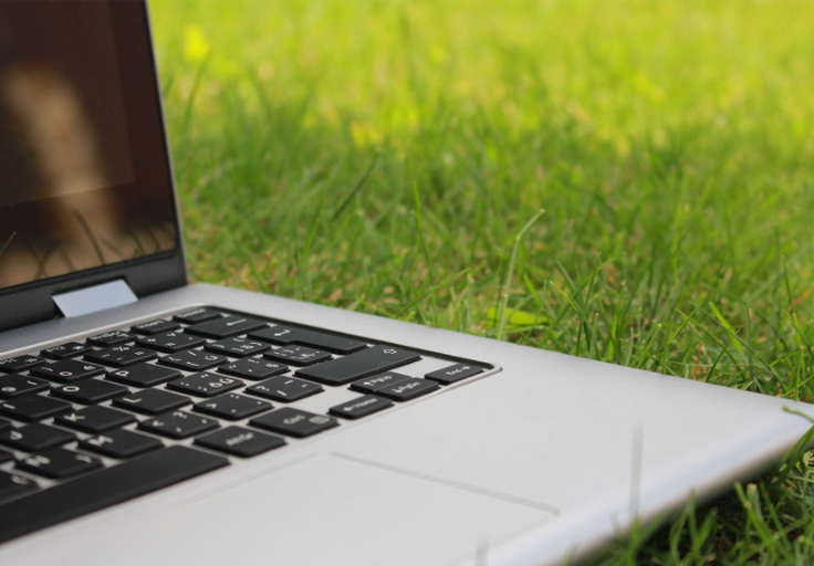 laptop on grass via pexels